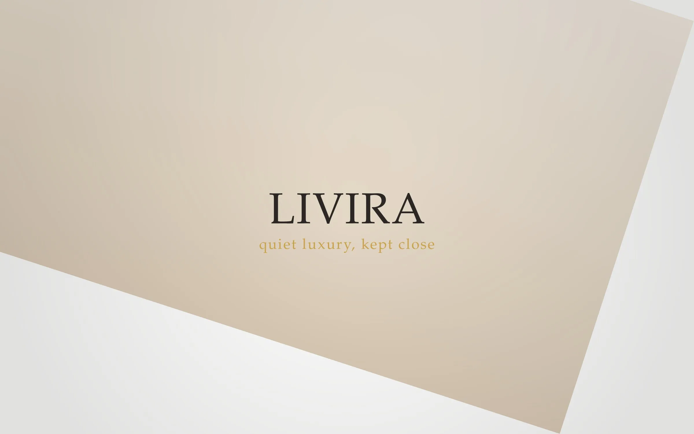 A hand wearing a Livira solitaire ring